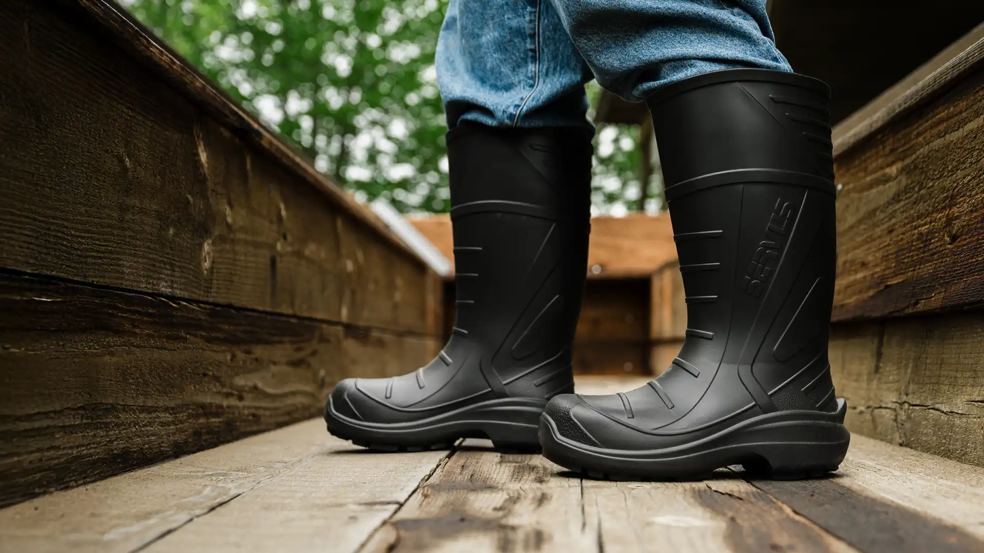 New WRK-LT-LIFE-Boots—person working outside on a rustic wood wagon