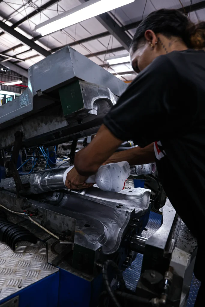 Servus factory worker removing boots
